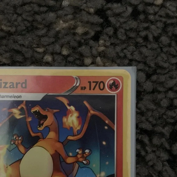 Pokemon Charizard Trading Card - Red and Yellow also has a sleeve - Picture 4 of 9